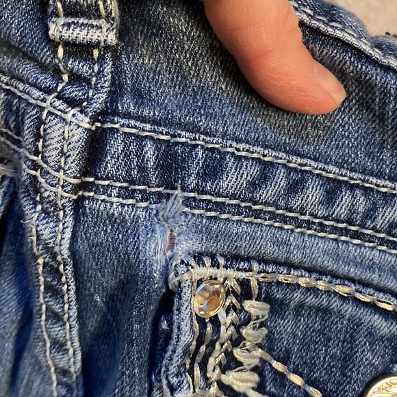 Low cut, boot cut jeans.  Small wear in pocket.  Shown in pictures - Picture 9 of 9